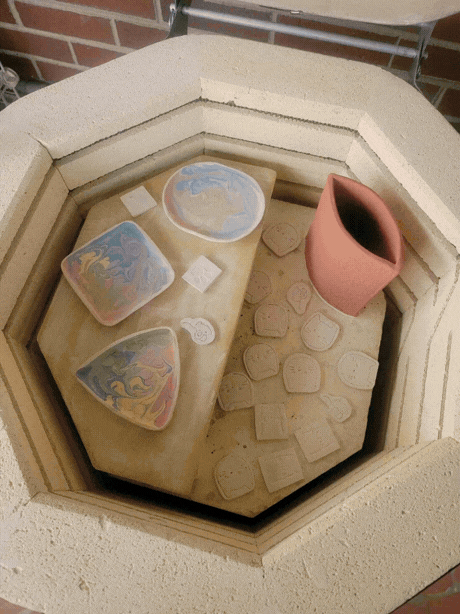 Unloading finished pieces from the kiln